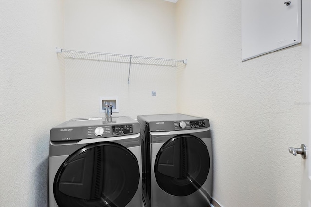 laundry room featuring washing machine and clothes dryer