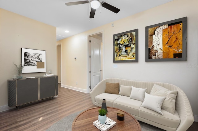 living room featuring hardwood / wood-style flooring and ceiling fan