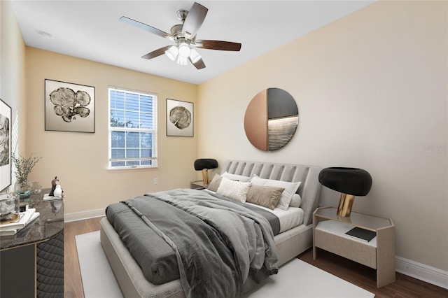 bedroom featuring dark wood-type flooring and ceiling fan