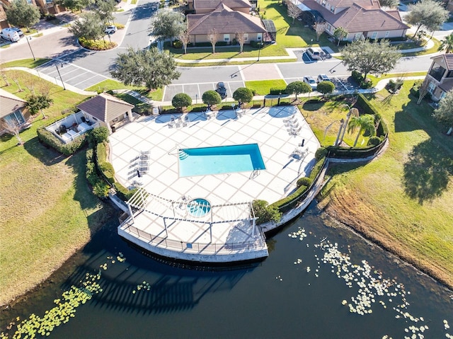 birds eye view of property with a water view