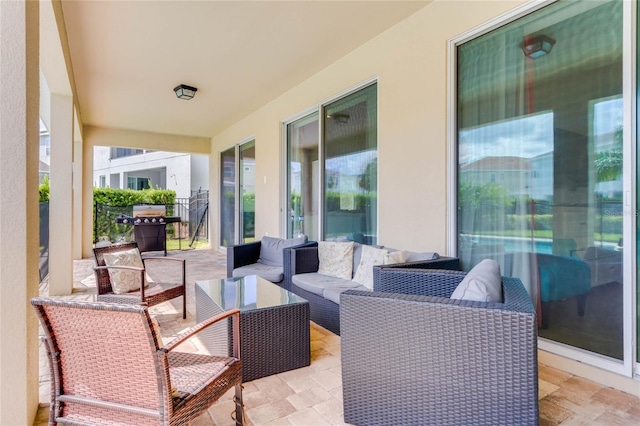 view of patio with outdoor lounge area and area for grilling