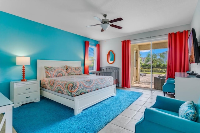 tiled bedroom with access to exterior and ceiling fan