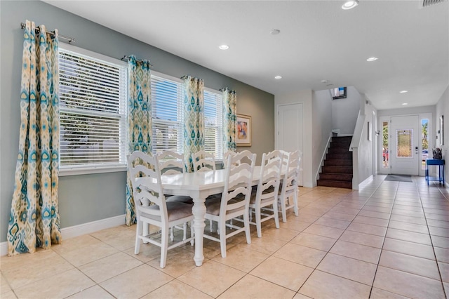 dining area featuring plenty of natural light and light tile patterned floors