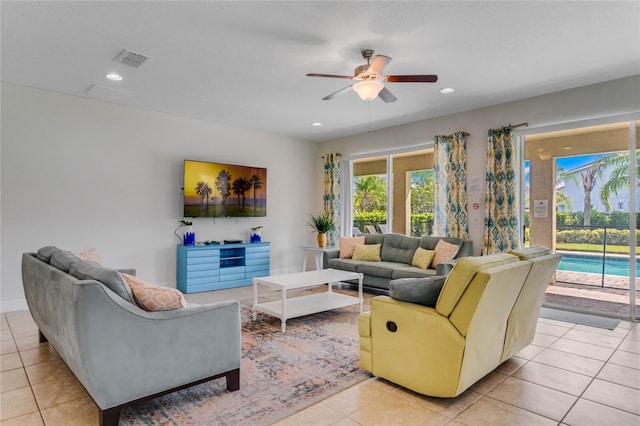 tiled living room featuring ceiling fan