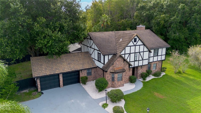 view of front of house with a garage and a front yard