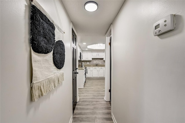 hallway featuring light hardwood / wood-style flooring