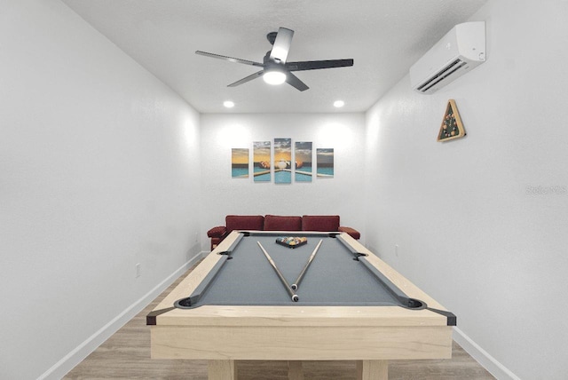 recreation room featuring ceiling fan, wood-type flooring, pool table, and a wall mounted AC