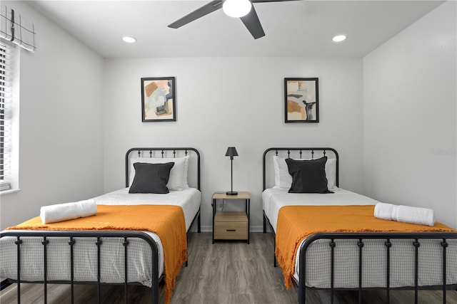 bedroom with ceiling fan and dark hardwood / wood-style floors