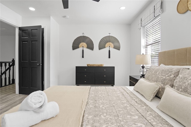 bedroom featuring ceiling fan and wood-type flooring