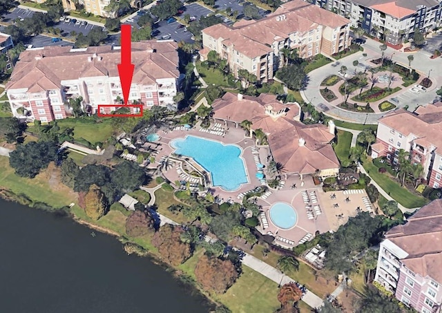 birds eye view of property with a water view