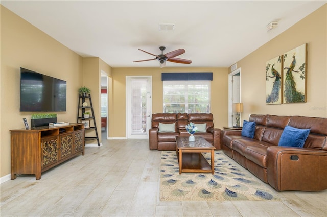5012 Shoreway Loop Unit 10207, Orlando, FL 32819 - living area featuring a ceiling fan and wood finished floors
