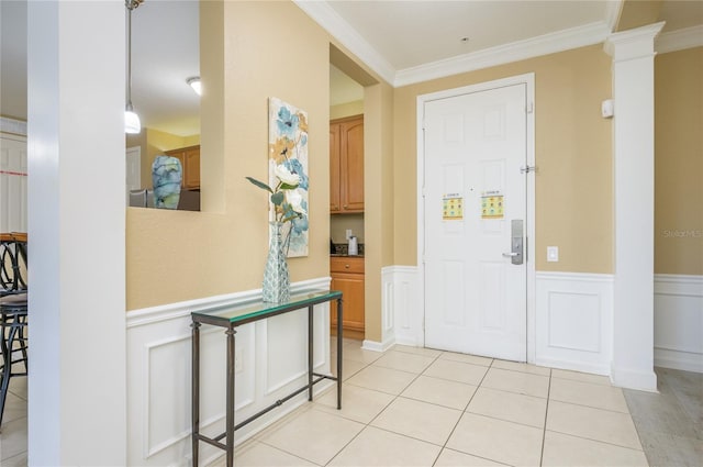 5012 Shoreway Loop Unit 10207, Orlando, FL 32819 - entryway with wainscoting, crown molding, light tile patterned floors, and a decorative wall