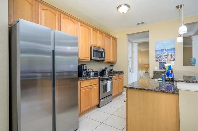 5012 Shoreway Loop Unit 10207, Orlando, FL 32819 - kitchen with appliances with stainless steel finishes, dark stone countertops, light tile patterned floors, pendant lighting, and ornamental molding