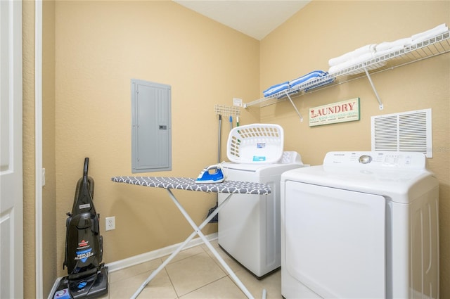5012 Shoreway Loop Unit 10207, Orlando, FL 32819 - laundry area with electric panel, separate washer and dryer, and tile patterned floors
