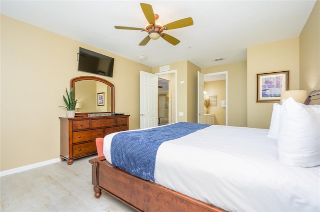 5012 Shoreway Loop Unit 10207, Orlando, FL 32819 - bedroom with light wood-type flooring and a ceiling fan