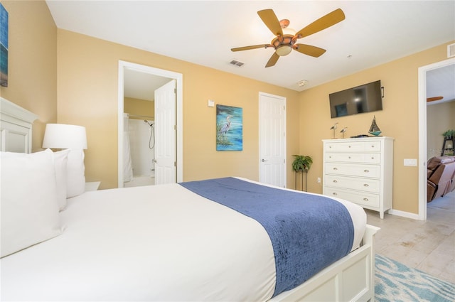 5012 Shoreway Loop Unit 10207, Orlando, FL 32819 - bedroom with a ceiling fan and connected bathroom