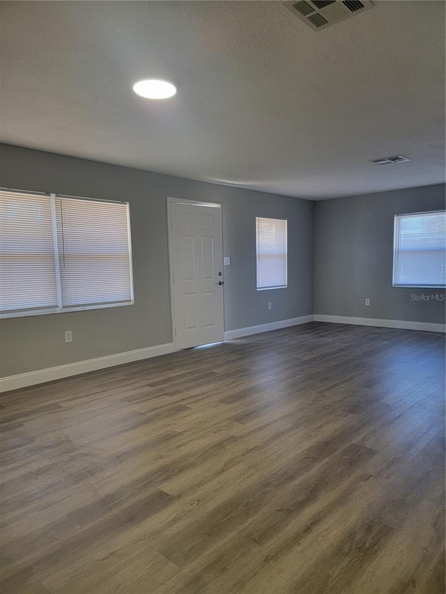 empty room featuring dark hardwood / wood-style floors