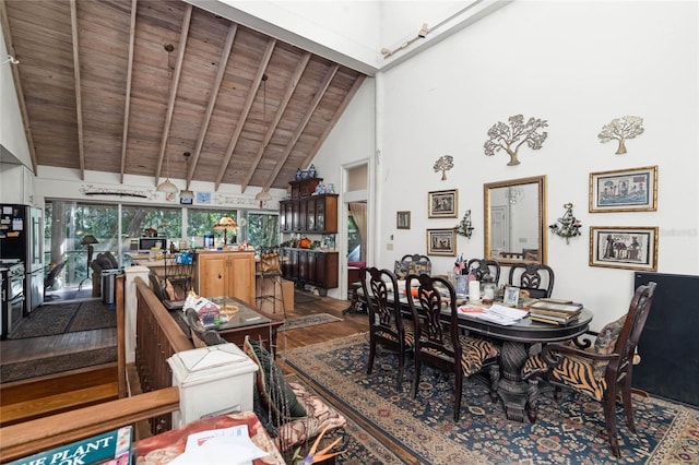 dining area featuring beam ceiling, hardwood / wood-style floors, wood ceiling, and high vaulted ceiling