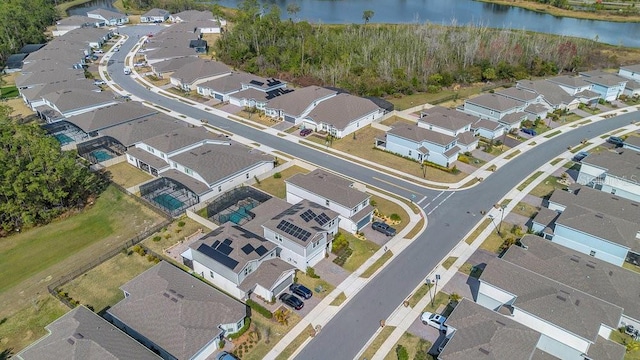 drone / aerial view with a water view