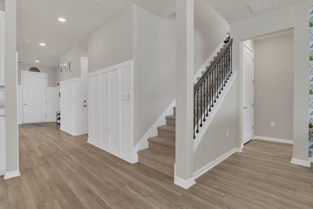 stairway featuring hardwood / wood-style flooring