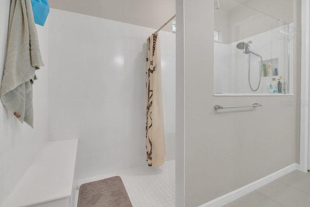 bathroom featuring tile patterned floors and a shower with curtain