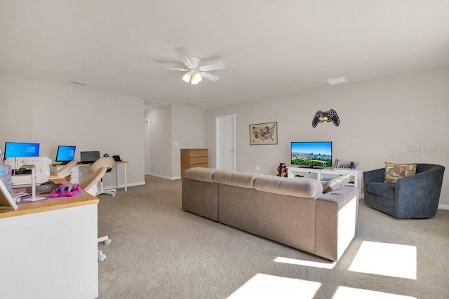 living room with light colored carpet and ceiling fan