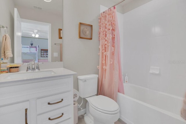 full bathroom with vanity, shower / bath combo, and toilet