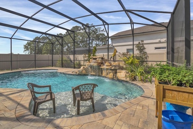 view of swimming pool with pool water feature, a patio, and glass enclosure