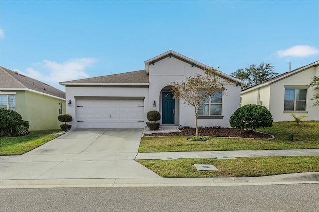 ranch-style house featuring a front yard, concrete driveway, an attached garage, and stucco siding