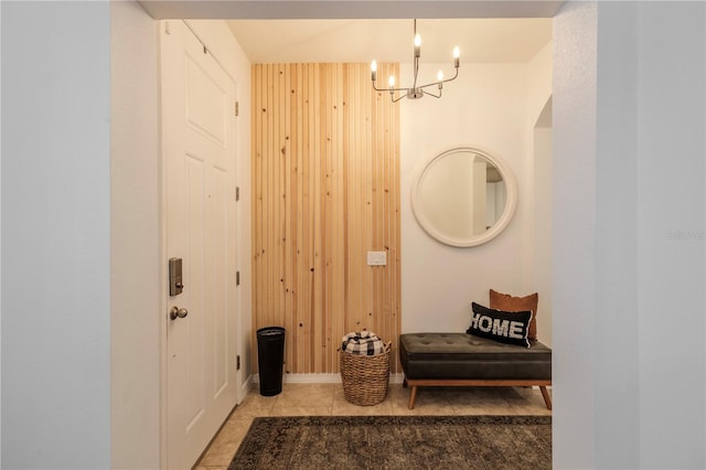 interior space featuring wooden walls and an inviting chandelier