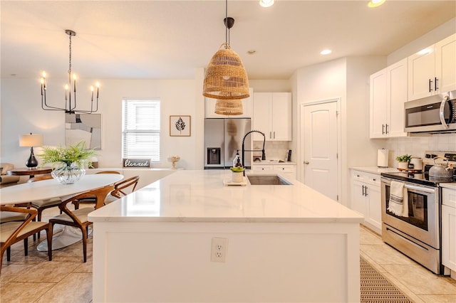 kitchen featuring stainless steel appliances, recessed lighting, white cabinets, and tasteful backsplash