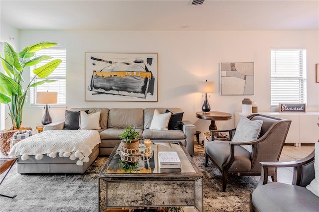 living area featuring a healthy amount of sunlight and visible vents