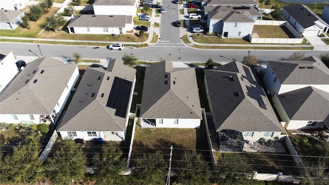 birds eye view of property with a residential view