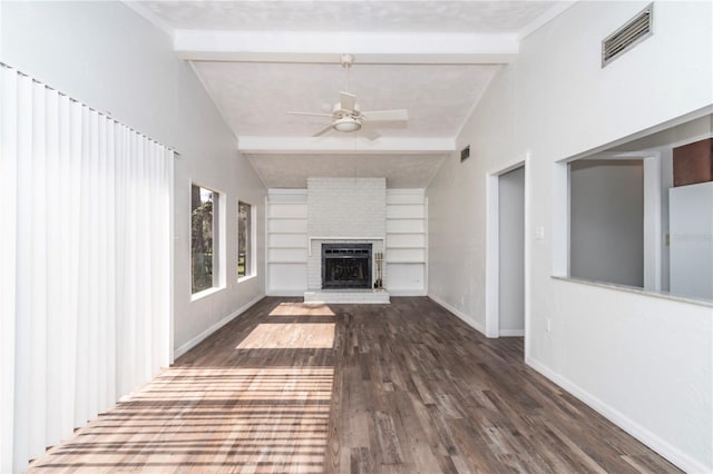 unfurnished living room with dark hardwood / wood-style flooring, vaulted ceiling with beams, ceiling fan, built in features, and a brick fireplace