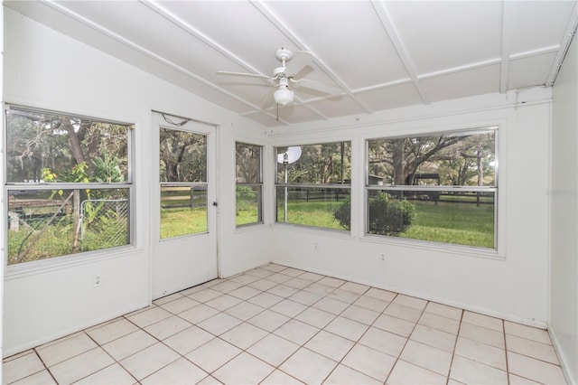 unfurnished sunroom featuring ceiling fan and lofted ceiling