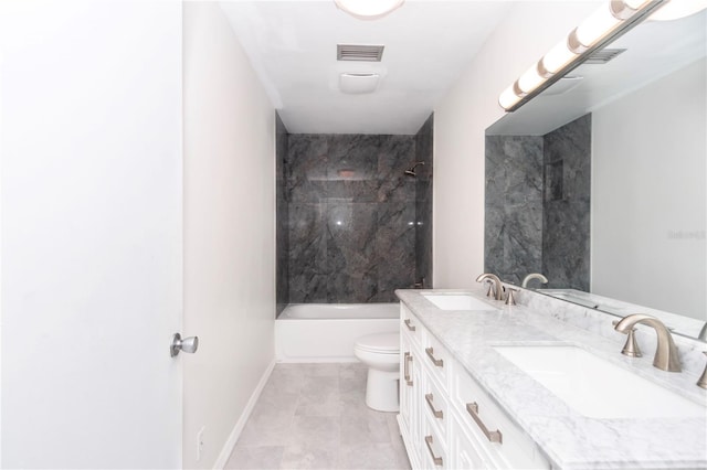 full bathroom featuring vanity, toilet, and tiled shower / bath