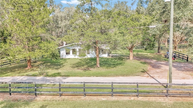 view of yard with a rural view