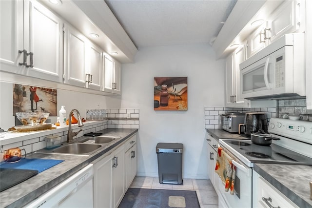 kitchen featuring light tile patterned floors, sink, white appliances, white cabinets, and decorative backsplash