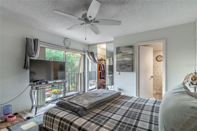 bedroom featuring ceiling fan, connected bathroom, a textured ceiling, access to outside, and a closet