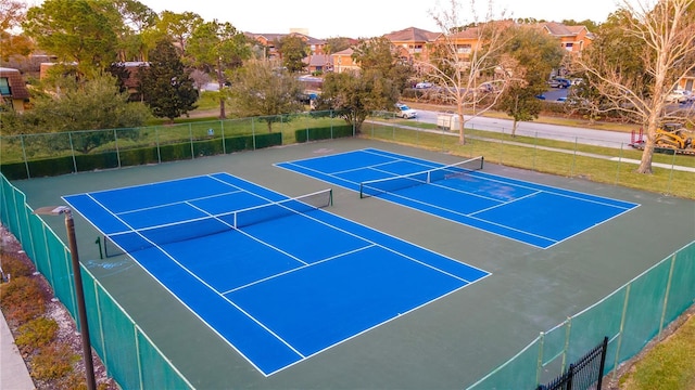 view of sport court with basketball hoop