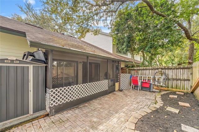 view of patio / terrace featuring a sunroom