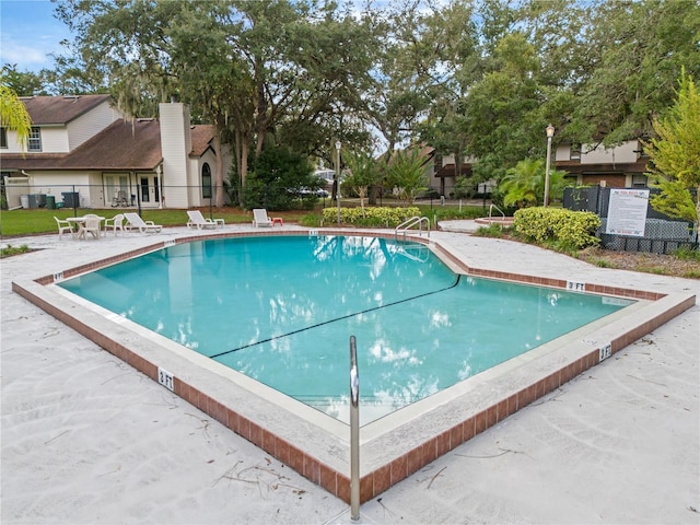 view of swimming pool featuring a patio