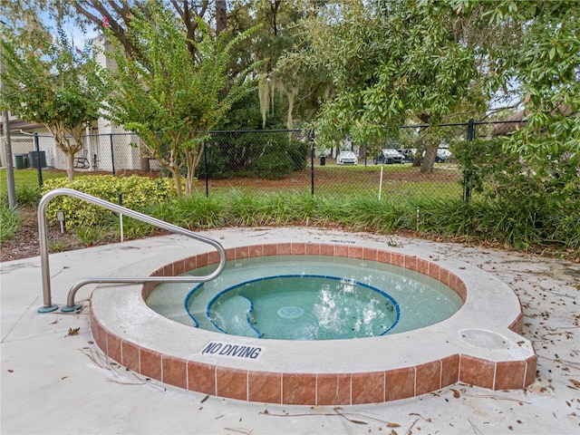 view of pool with a community hot tub