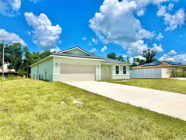 single story home with a garage, central AC, and a front yard