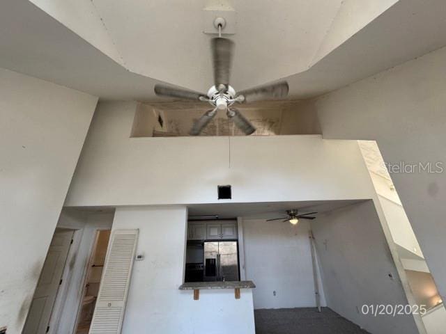 entrance to property featuring ceiling fan