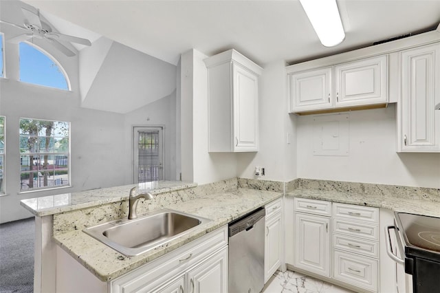 kitchen featuring appliances with stainless steel finishes, white cabinetry, a sink, and a peninsula