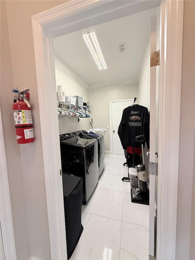 washroom featuring washer and clothes dryer