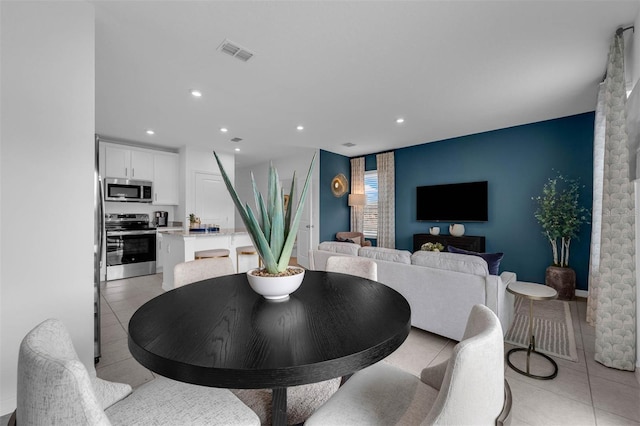 dining area with light tile patterned floors