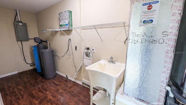 interior space featuring sink, dark hardwood / wood-style floors, hookup for a washing machine, and electric panel