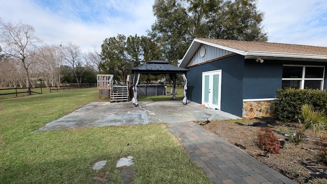 view of yard featuring a patio area and a gazebo